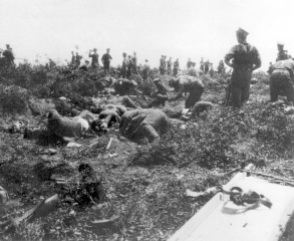 Allied and Turkish troops collecting the dead for burial whilst the guns had stopped firing